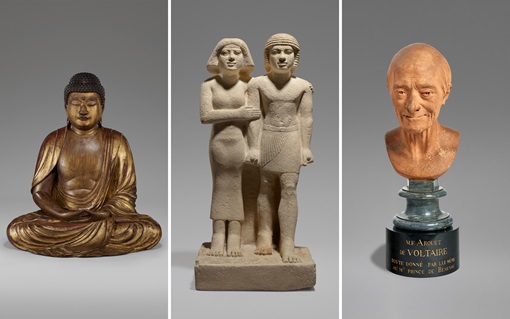 Three statues are displayed: a seated Buddha, an Egyptian couple, and a bust with a pedestal.