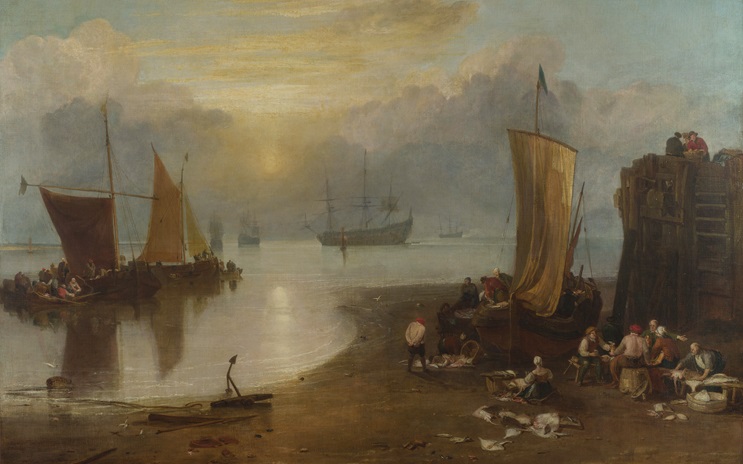 Fishing boats at a misty harbor with people gathered on shore cleaning and sorting fish.