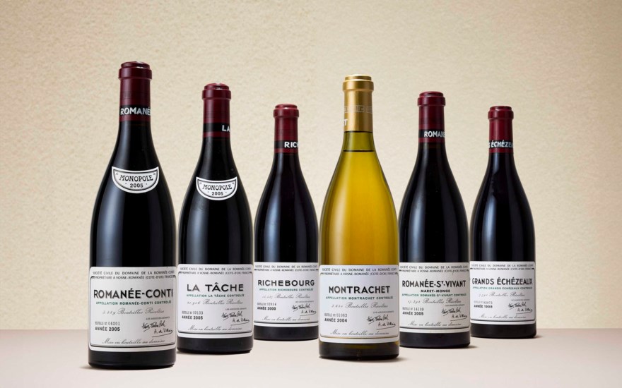 Six bottles of Domaine de la Romanée-Conti wine are displayed, including Montrachet and Romanée-Conti.