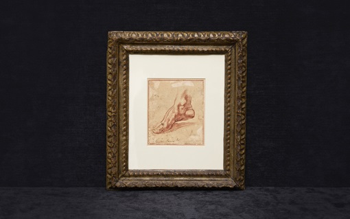 A framed sketch shows a detailed drawing of a human foot, set against a dark background.