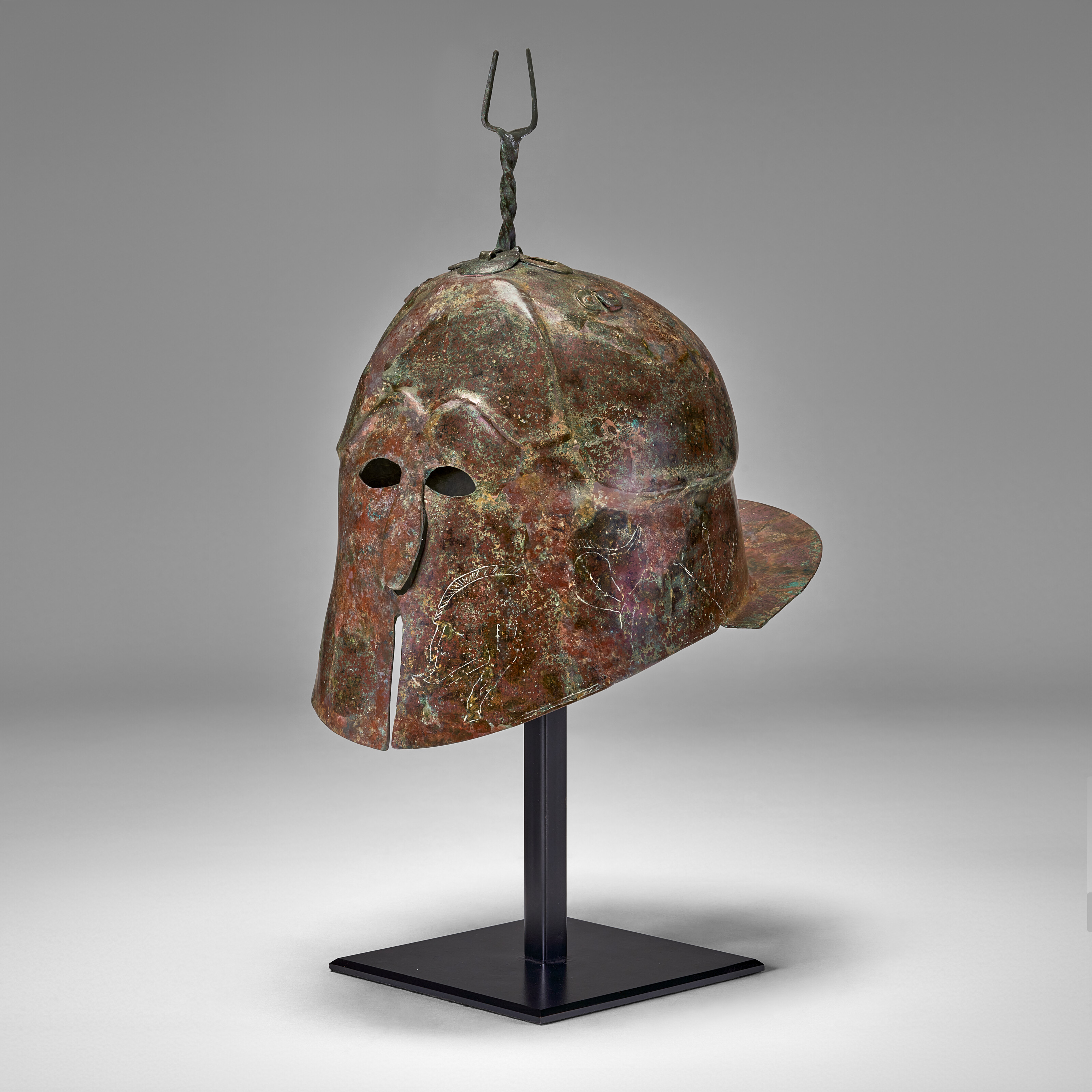A GREEK BRONZE APULO-CORINTHIAN HELMET, MAGNA GRAECIA, LATE